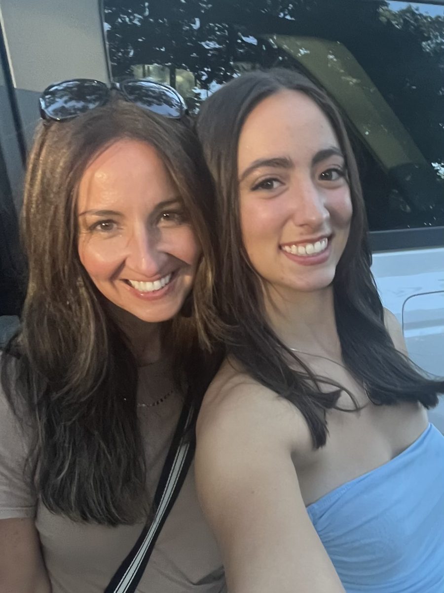 Mom and Scarlett happily capturing the memory of Homecoming pictures together.