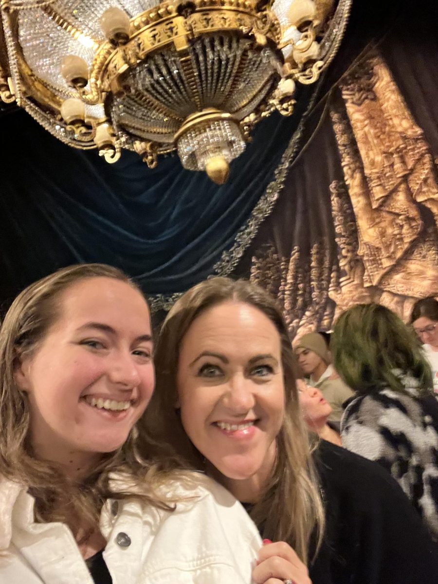 My mom and I standing in front of the famous chandelier